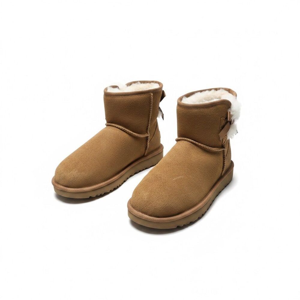 Brown Koolaburra Ugg-style boots with bow detail